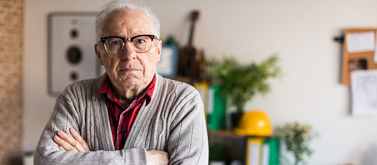 Old Businessman in casual clothing with arms crossed